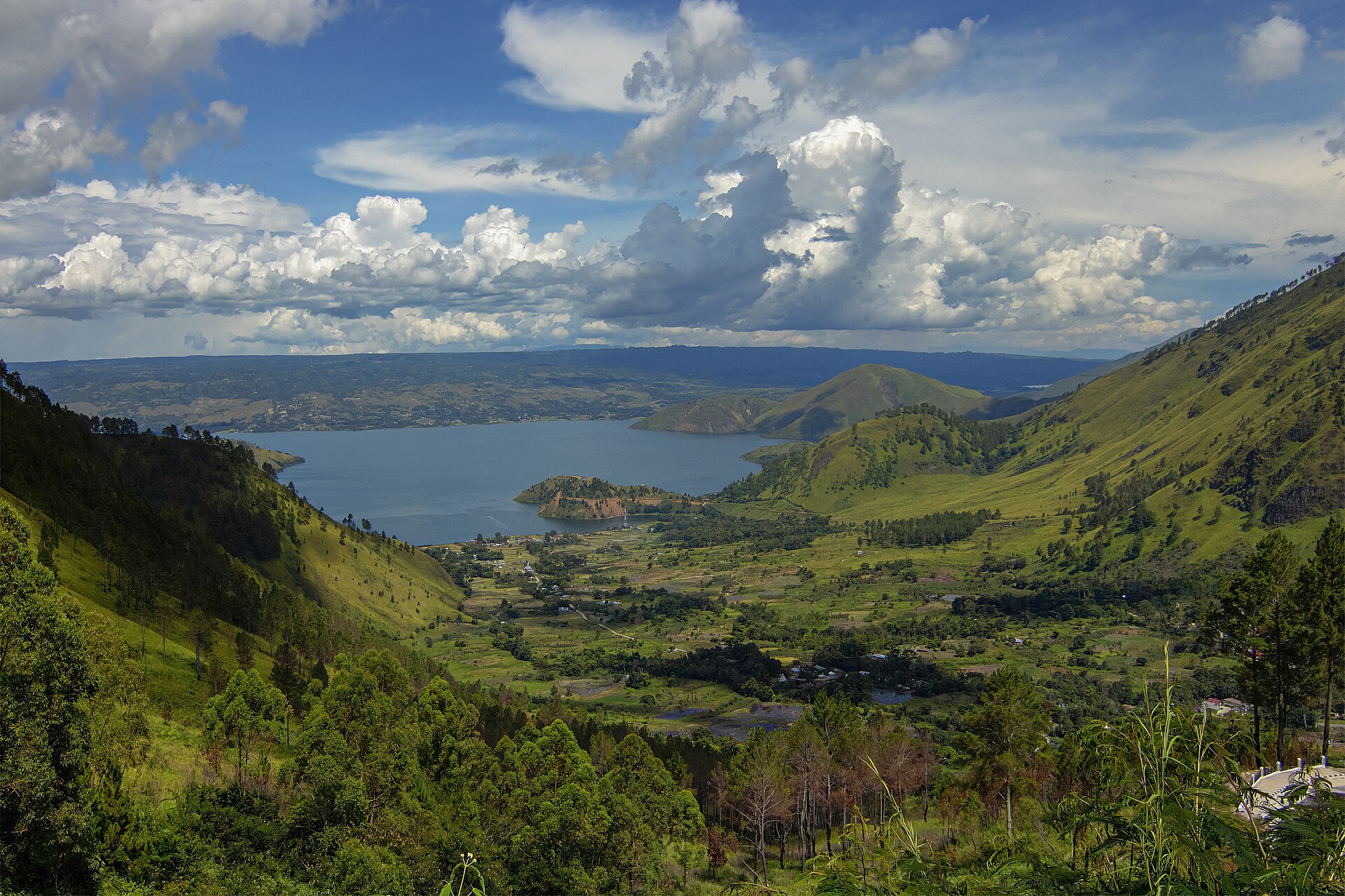 Lake Toba and green surrounding hills in North Sumatra, Indonesia